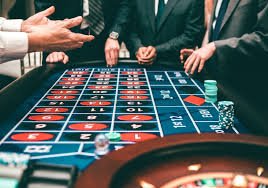 Live baccarat dealer at rajaslot login studio table with real-time card dealing